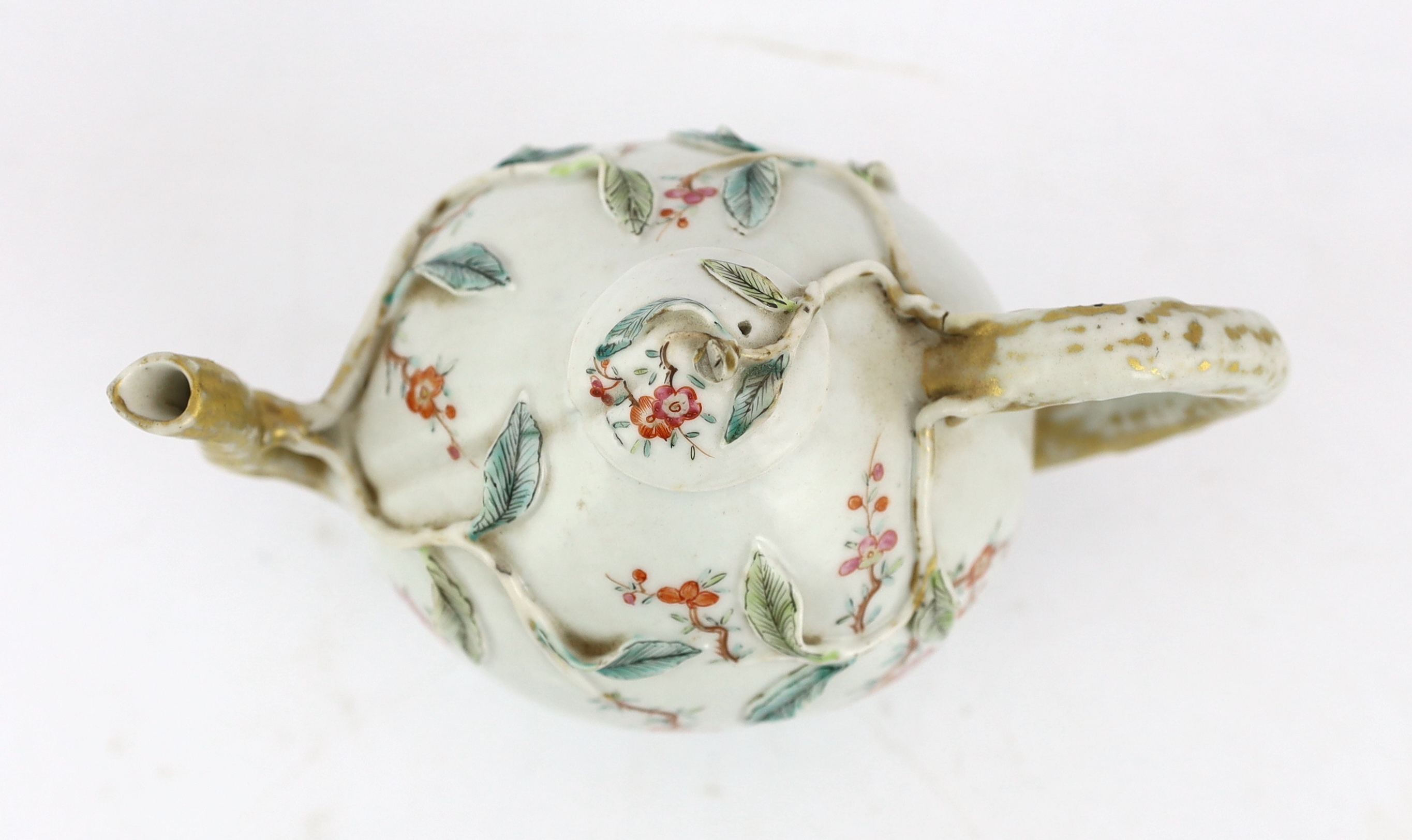 A Chinese enamelled porcelain peach-shaped teapot, Qianlong period (1736-95), wear to gilding